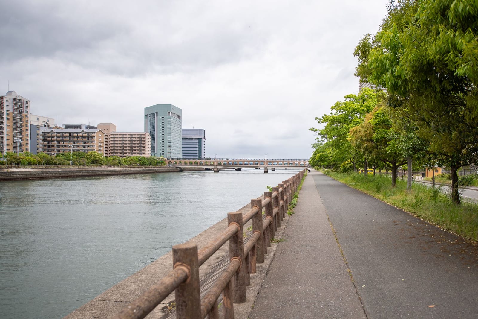 Riverfront promenade and the city skyline across the water at Fukuoka