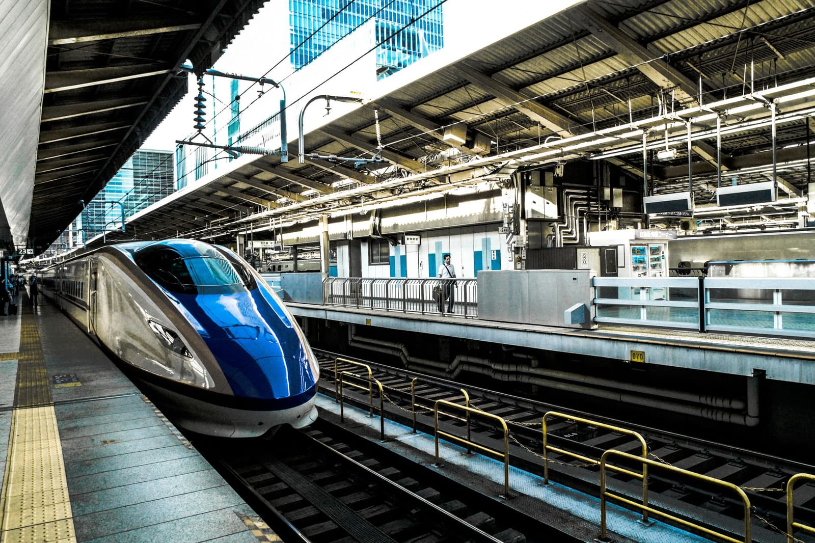Shinkansen bullet train waiting at a platform in a Japanese station
