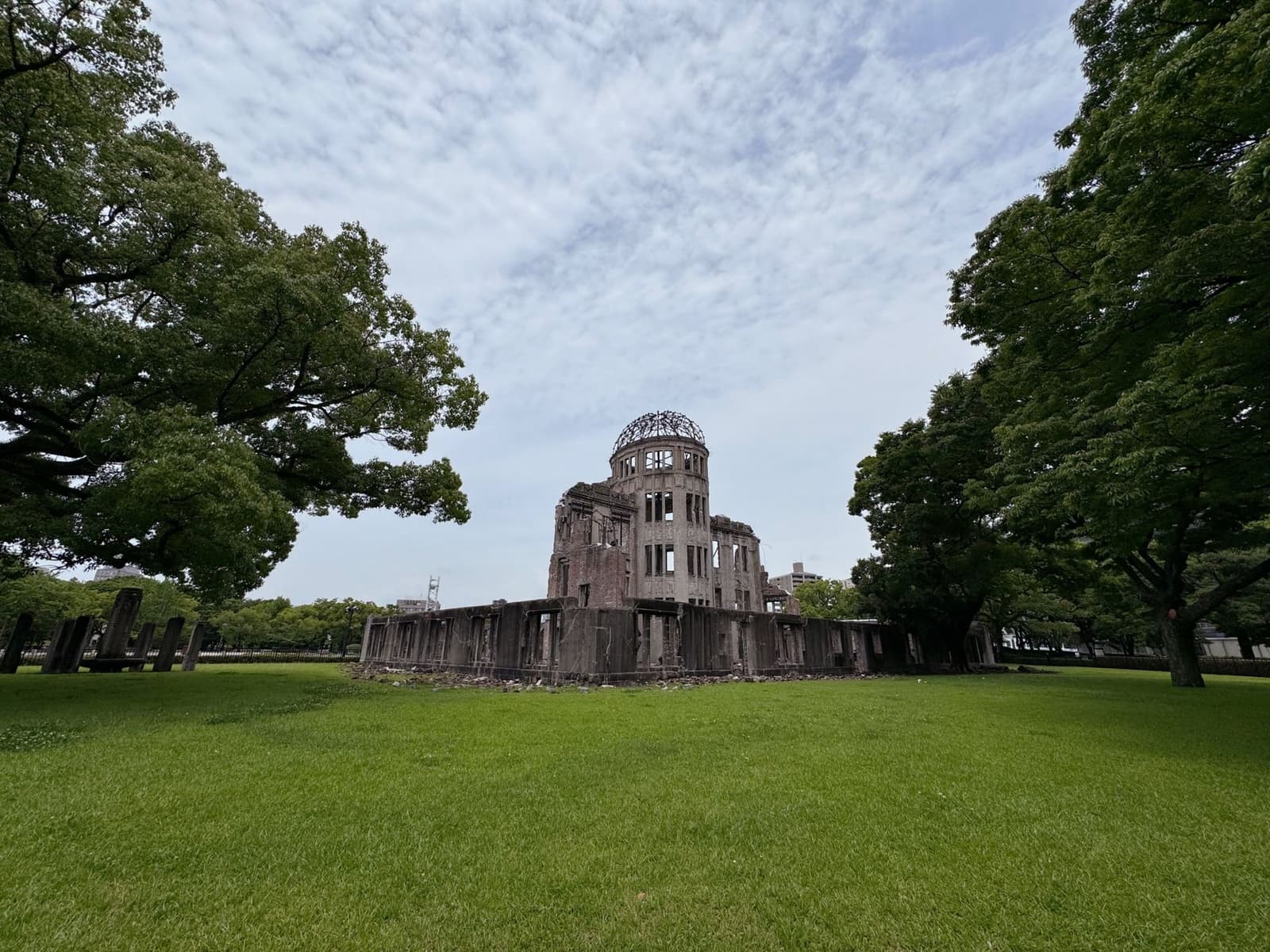 Memorial grounds of Hiroshima Peace Memorial Park, with the Atomic Bomb Dome beyond the trees