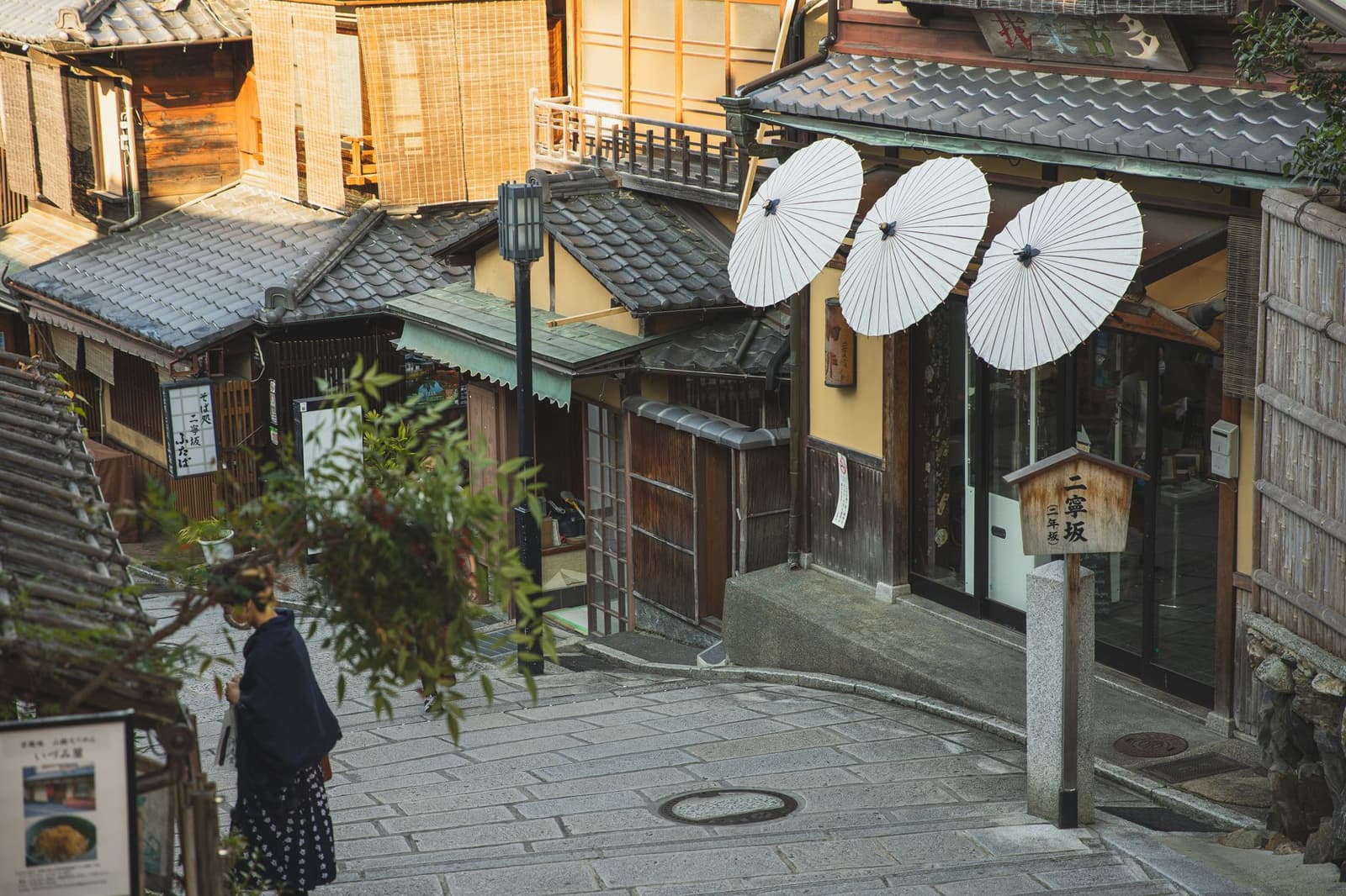 Stone lanes and wooden shopfronts of Higashiyama, Kyoto, empty of coach groups