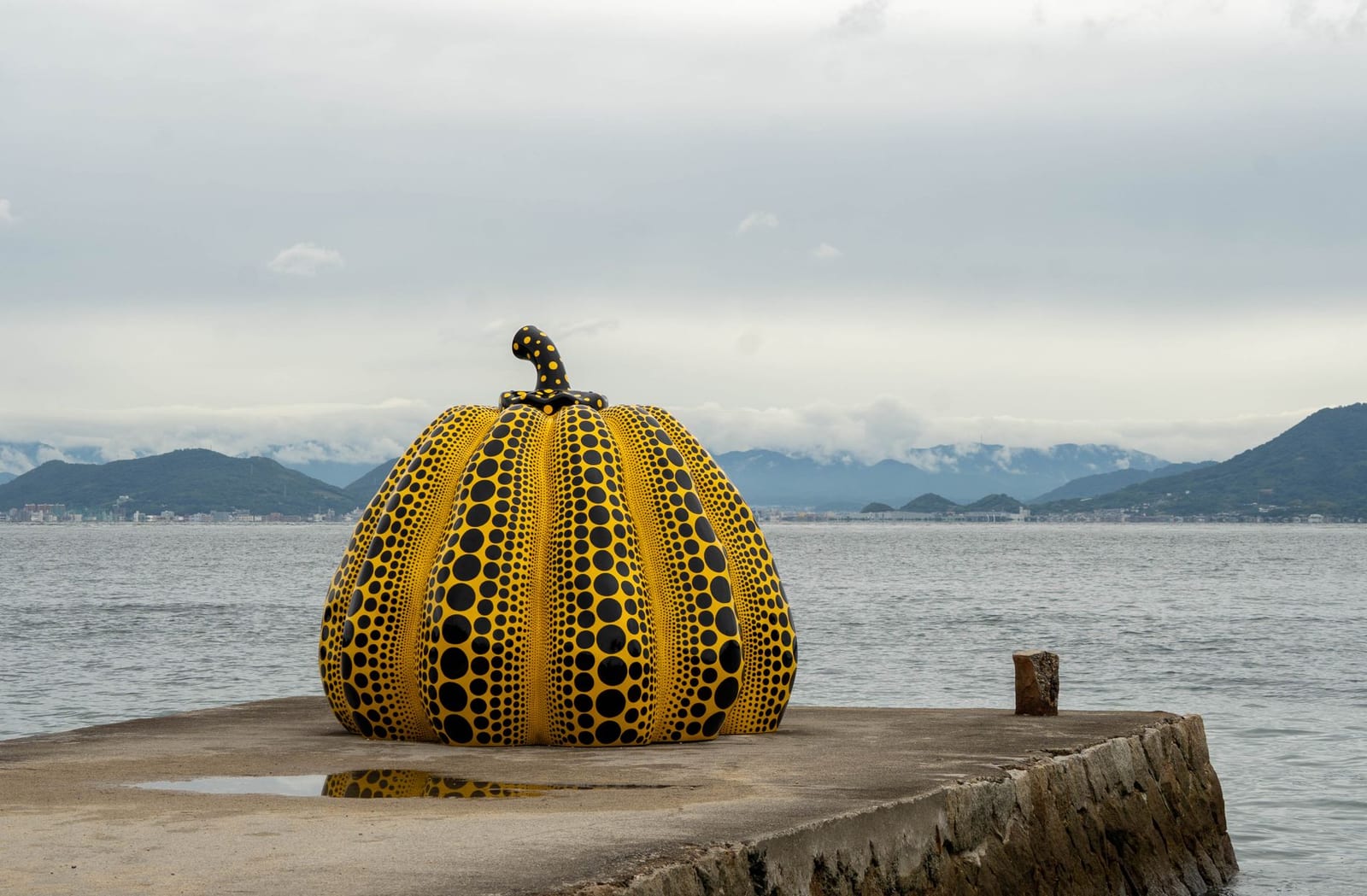 Yayoi Kusama's yellow pumpkin sculpture on the pier at Naoshima