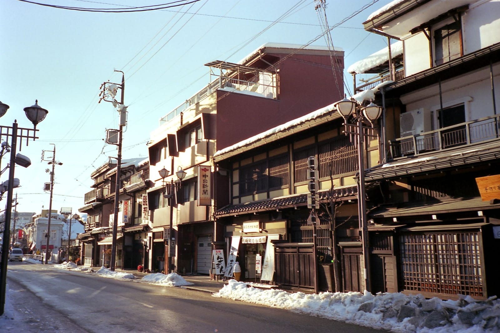 Traditional wooden buildings along a historic street in Takayama in winter